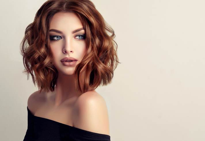 Attractive brunette woman with modern, trendy and elegant hairstyle.