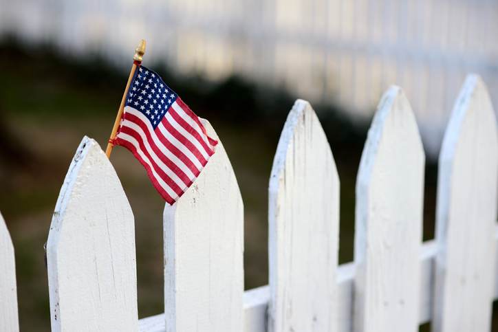 American Flag on White Picket Fence